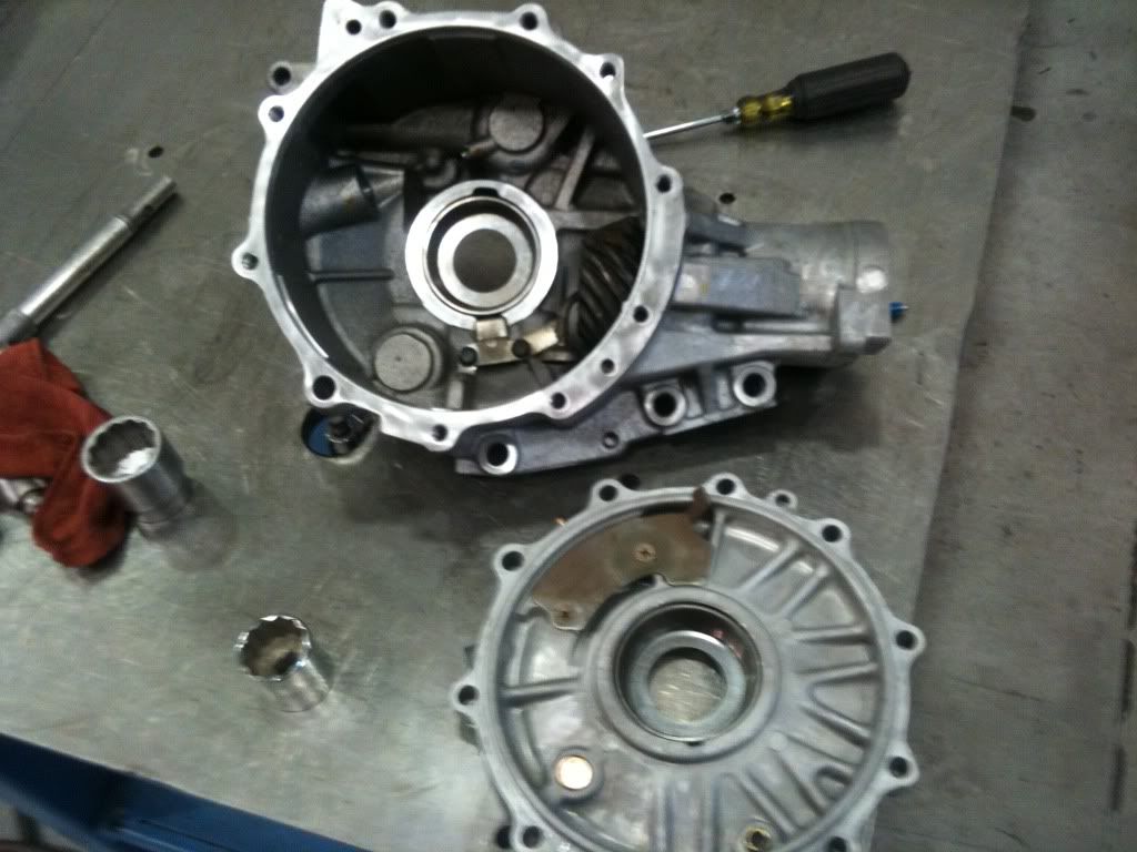 Step 8: Next I use a flat head screw driver to remove both seals. One from the pinion shaft and the other from the diff housing cover.
